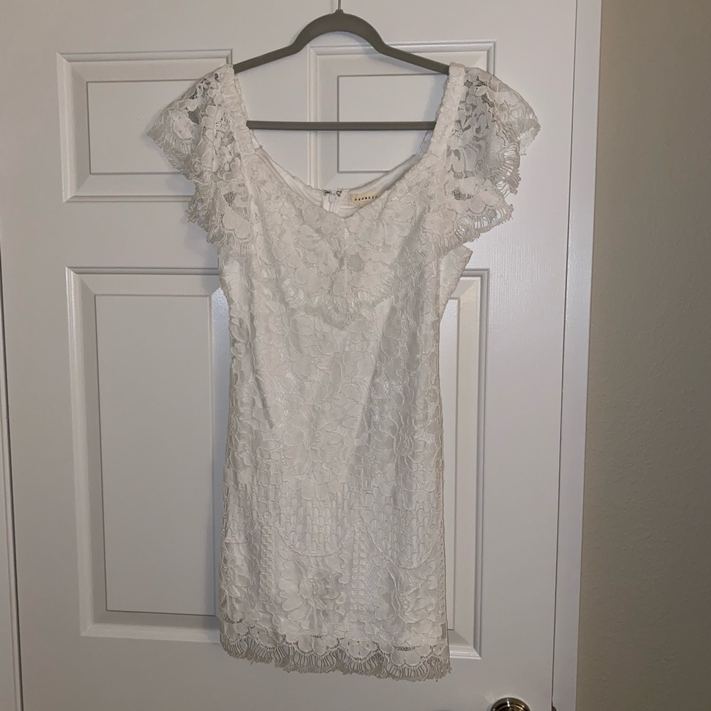 White off-the-shoulder, lace dress.